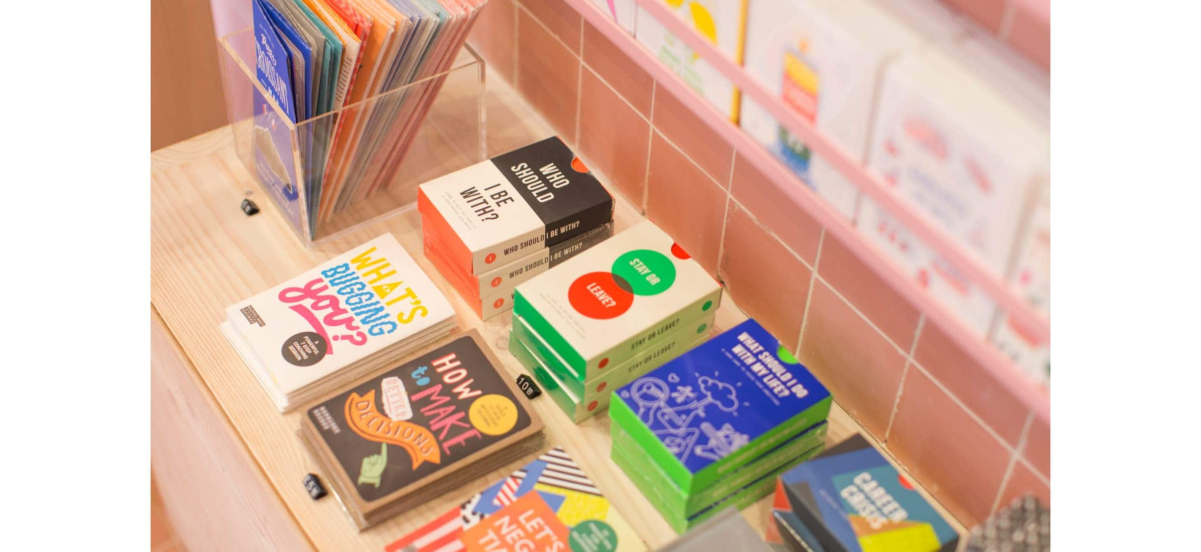 A display table of books, games and flyers neatly laid out.